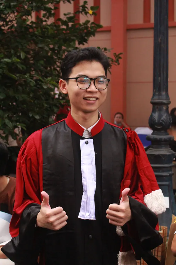 Nguyen in a graduation gown