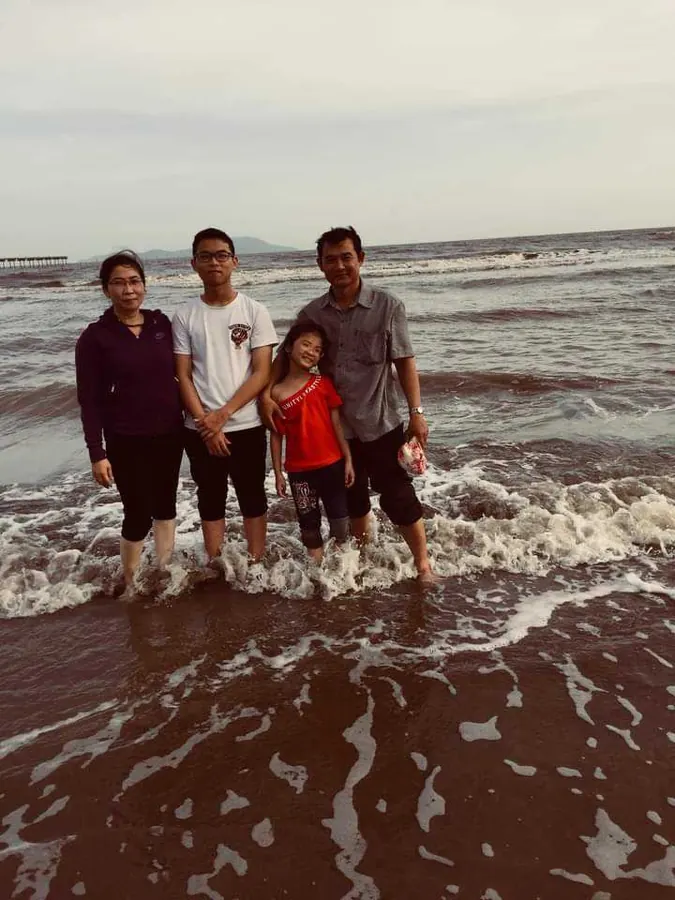 Nguyen with family at the beach
